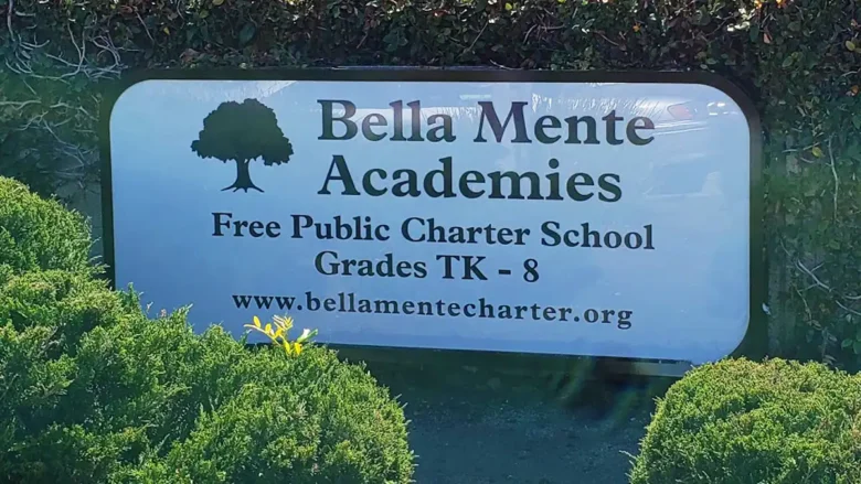 Outdoor cabinet sign for Bella Mente Academies, a free public charter school in Vista, California, featuring tree logo and school website