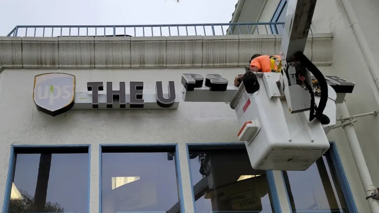 UPS Channel Letter Install – Encinitas, CA Innovative Sign Systems - UPS channel letter sign installed by Innovative Sign Systems in Encinitas, California, mounted on stucco facade with precision alignment and clean illumination.