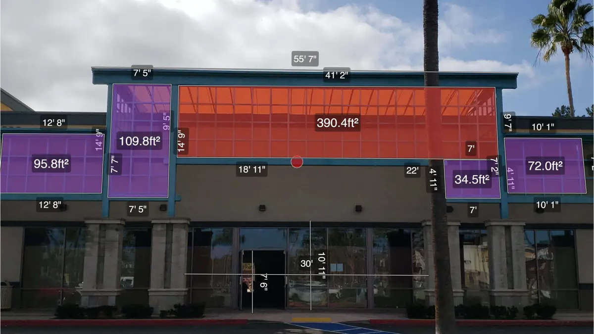 Facade survey of Salon World Suites storefront with color‑coded overlay showing measured sign areas (orange 390.4 ft²; purples 95.8, 109.8, 34.5, 72.0 ft²), building width and height dimensions, and a red center reference point.